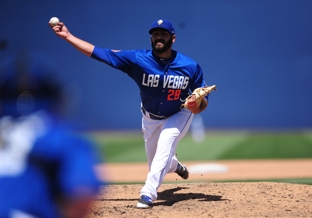 Las Vegas 51s relief pitcher Chasen Bradford delivers to the Memphis Redbirds runner in the sixth inning of their Triple-A minor league baseball game at Cashman Field in Las Vegas Monday, May 30,  ...