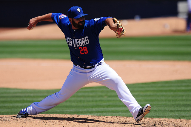 Las Vegas 51s relief pitcher Chasen Bradford delivers to the Memphis Redbirds runner in the seventh inning of their Triple-A minor league baseball game at Cashman Field in Las Vegas Monday, May 30 ...