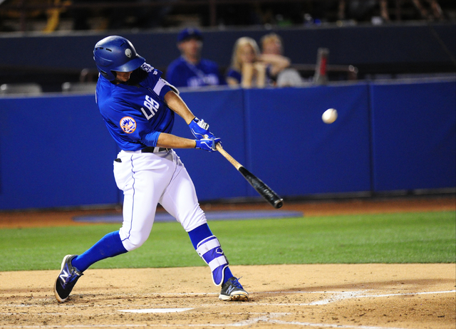 Las Vegas 51s batter T.J. Rivera hits an RBI sacrifice fly ball against the Nashville Sounds in the fourth inning of their minor league baseball game at Cashman Field in Las Vegas Monday, May 23,  ...