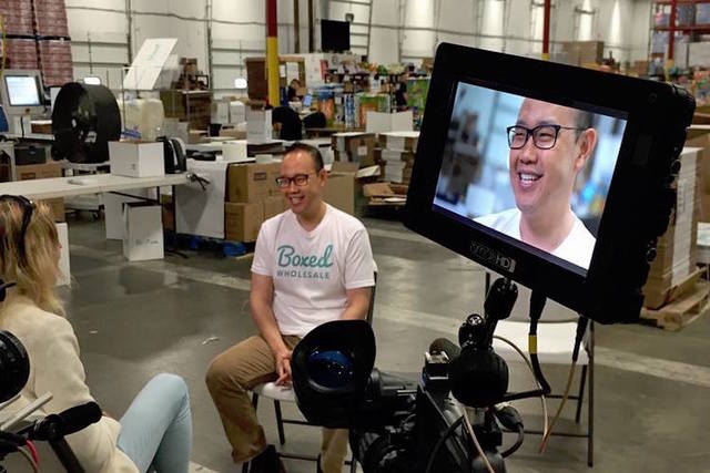 Boxed CEO Chieh Huang is seen at one of the company's fulfillment centers. (Boxed Wholesale/Facebook)