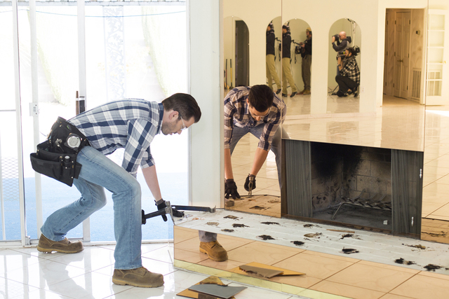 Jonathan Scott during demolition of the living room, as seen on Brother vs Brother. (Courtesy HGTV)