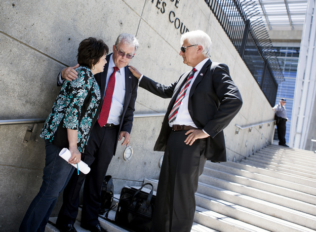 Attorneys Larry Klaymam, right, and Joel Hansen talks to Carol Bundy, wife of Nevada rancher Cliven Bundy, in front of Lloyd George U.S. Courthouse after filing a lawsuit  against President Barack ...