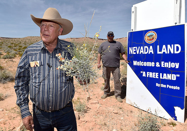Rancher Cliven Bundy displays a bouquet of desert foliage that his cattle grazes on during a news conference at an event near his ranch in Bunkerville on Saturday, April 11, 2015.  (David Becker/L ...