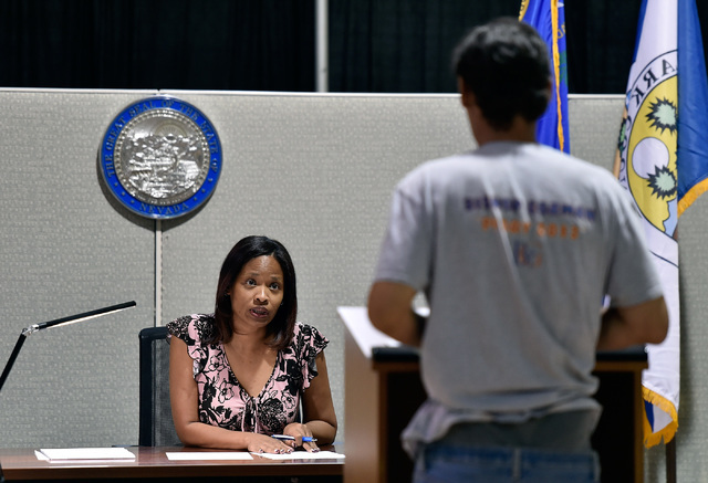 Hearing officer Phung Jefferson, left, speaks with Christopher Masty, after his was arrested for selling water on Las Vegas Boulevard at the newly opened Civil Diversion Program facility just off  ...