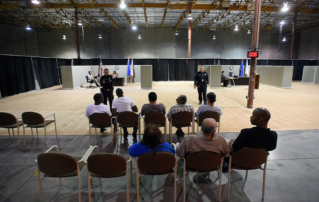 Arrestees wait to be called at the newly opened Civil Diversion Program facility just off the Las Vegas Strip Friday, May 27, 2016. The pilot program, set up in a converted warehouse, is designed  ...