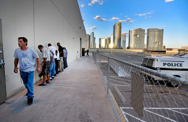 Arrestees are lined up before they are lead into the newly opened Civil Diversion Program facility just off the Las Vegas Strip Friday, May 27, 2016. The pilot program, set up in a converted wareh ...