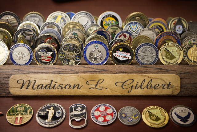 A selection of challenge coins is seen Wednesday, April 27, 2016 on Capt. Madison Gilbert's desk.  She is officer in charge at the 757th Aircraft Maintenance Squadron. (Jeff Scheid/Las Vegas Revie ...