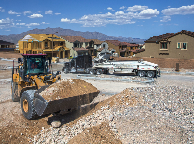 Construction workers clear space for an empty lot in the newly-developed Skye Canyon community, Monday, May 23, 2016, in Las Vegas. Benjamin Hager/Las Vegas Review-Journal