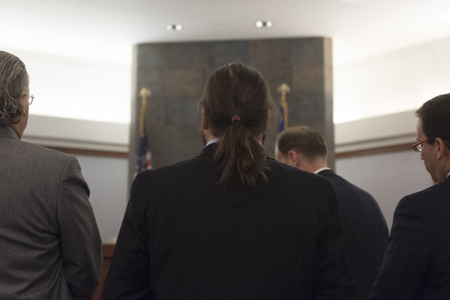 Austin Lee &quot;Chumlee&quot; Russell, center, stands before Judge Joseph S. Sciscento with his attorneys in court at the Regional Justice Center in Las Vegas Monday, May 23, 2016. The re ...