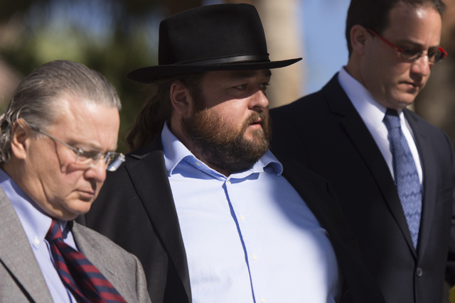 Austin Lee &quot;Chumlee&quot; Russell, center, and his attorneys, leave the Regional Justice Center in Las Vegas Monday, May 23, 2016. The reality TV actor from &quot;Pawn Stars&q ...