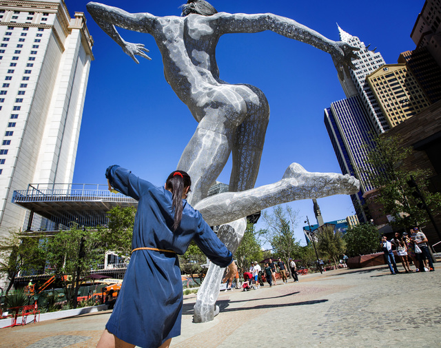 Mora Rojas from Guatemala strikes a poise similar to the "Bliss Dance" statue at The Park on Tuesday, April 5, 2016. Jeff Scheid/Las Vegas Review-Journal Follow @jlscheid