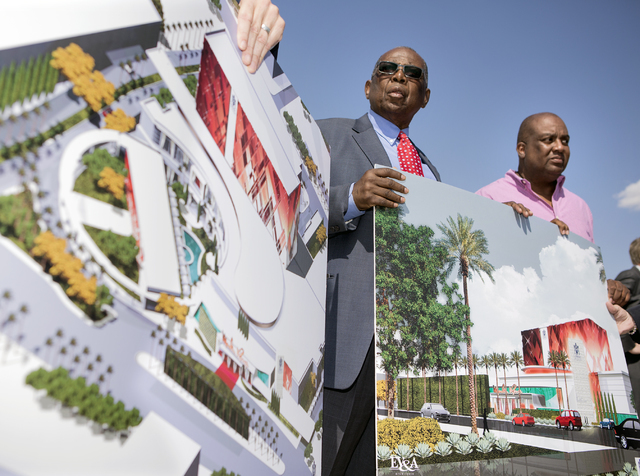 Gene Collins, left, vice president of Moulin Rouge Holdings and Scott Johnson, president of Moulin Rouge Holdings, holds a rendering during a ground breaking at the original Moulin Rouge site at 9 ...