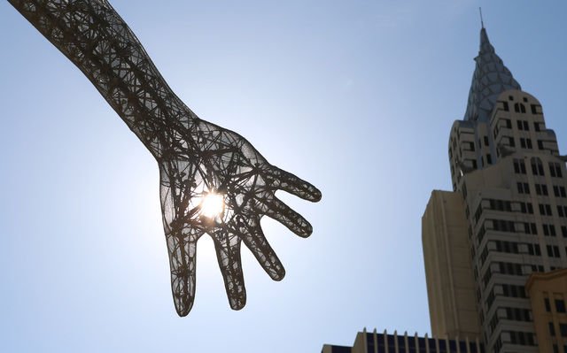 The morning sun's rays pierce the "Bliss Dance" sculpture at The Park near T-Mobile Arena on the Las Vegas Strip, Wednesday, May 11, 2016. (Bizuayehu Tesfaye/Las Vegas Review-Journal Follow @bizut ...