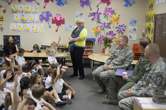 Kindergarten students at The Meadows School enjoy a visit May 10, 2016, from Creech Air force Base airmen. From left are teacher Ms. Verbon, Col. Cunningham, Col. Chittenden and Chief Ditore. Stud ...