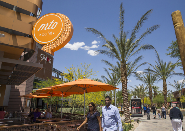 Shoppers walk through Downtown Summerlin, Wednesday, May 25, 2016, in Las Vegas. Approximately 17 million people have visited Downtown Summerlin, and mixed use development will add 12 new brands i ...