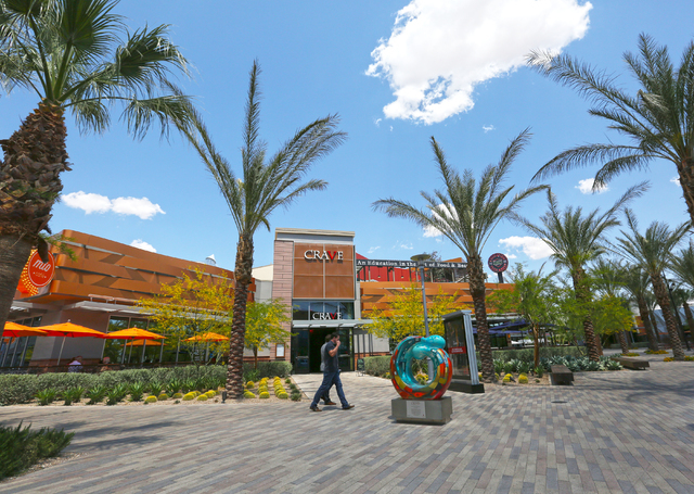 Shoppers walk through Downtown Summerlin, Wednesday, May 25, 2016, in Las Vegas. Approximately 17 million people have visited Downtown Summerlin, and mixed use development will add 12 new brands i ...