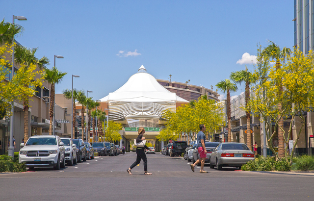 Shoppers walk through Downtown Summerlin, Wednesday, May 25, 2016, in Las Vegas. Approximately 17 million people have visited Downtown Summerlin, and mixed use development will add 12 new brands i ...