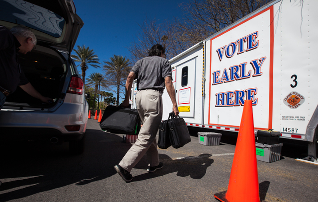 Clark County employee Jaime Mondala works on setting up a mobile trailer for early voting for the Las Vegas municipal elections at Trails Village Center, 1940 Village Center Circle in the Summerli ...