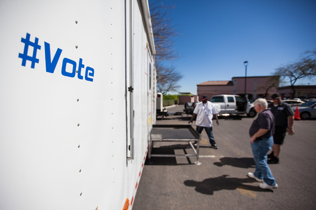 Clark County employees work on setting up a mobile trailer for early voting for the Las Vegas municipal elections at Trails Village Center, 1940 Village Center Circle in the Summerlin area of Las  ...
