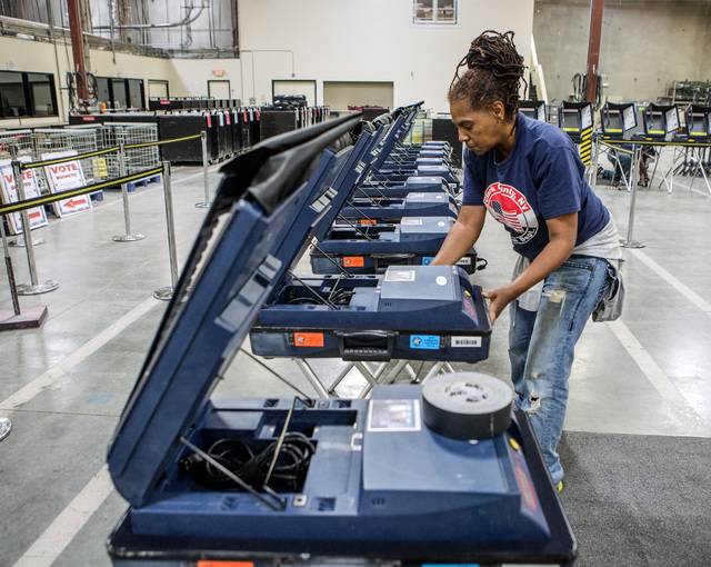 Program assistant Connie Sneed sets up voting machines during a training session at the Clark County Elections Department warehouse, 965 Trade Drive, North Las Vegas, on Thursday, May 12, 2016. Je ...
