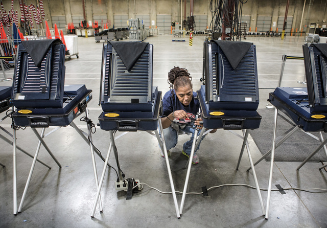 Program assistant Connie Sneed sets up voting machines during a training session at the Clark County Elections Department warehouse, 965 Trade Drive, North Las Vegas, on Thursday, May 12, 2016. Je ...