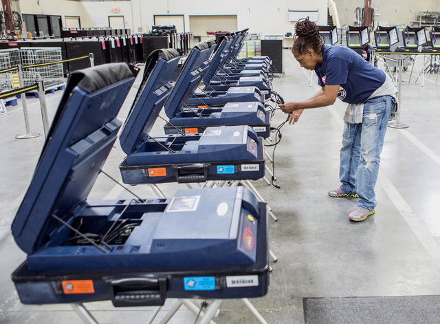 Program assistant Connie Sneed sets up voting machines during a training session at the Clark County Elections Department warehouse, 965 Trade Drive, North Las Vegas, on Thursday, May 12, 2016. Je ...