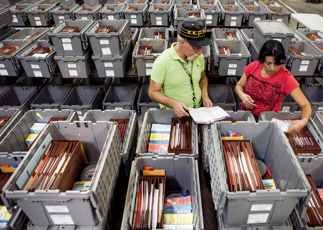 Warehouse personal Ron Moidel, left, and Maria Valdez, checks supplies in a team leader pickup crate at the Clark County Elections Department warehouse, 965 Trade Drive, North Las Vegas, on Thursd ...