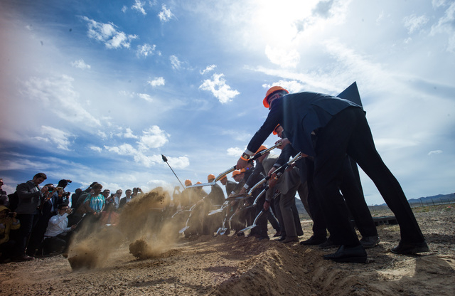 Government and Faraday Future officials shovel dirt during the groundbreaking for the company's planned 900-acre manufacturing site in North Las Vegas on Wednesday, April 13, 2016. Chase Stevens/L ...
