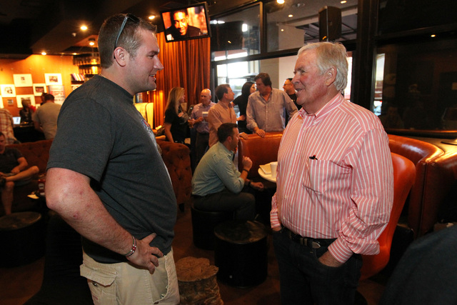 Bill Foley talks to hockey fan John Jacob Jordan at an event to promote season ticket sales for a potential NHL franchise Tuesday, March 24, 2015 at Born and Raised bar. (Sam Morris/Las Vegas Revi ...
