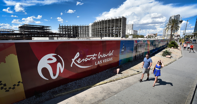 People walk by the construction site of Resorts World Las Vegas along the Strip Monday, May 2, 2016, in Las Vegas. The property, site of Boyd Gaming's mothballed Echelon project, purchased by Mala ...