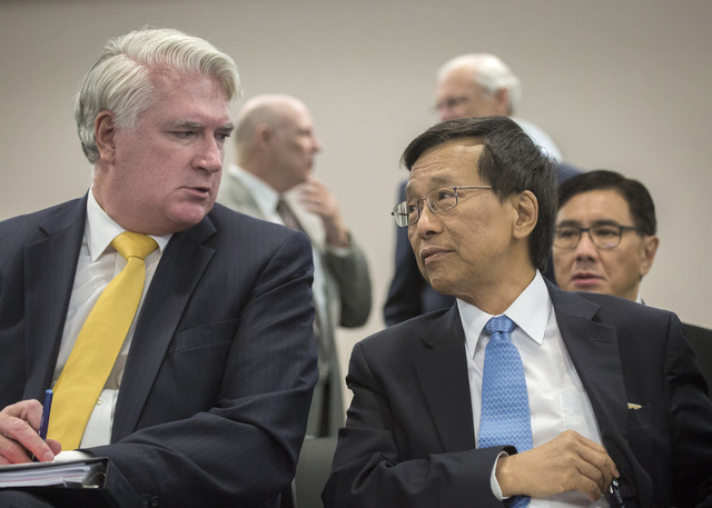 Kok Thay Lim, right, chairman and CEO of Genting Group, talks to gaming attorney Mark Clayton while appearing before the Gaming Control Board for licensing on Wednesday, May 4, 2016. The Malaysian ...