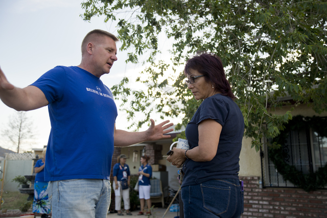Retired Sgt. Maj. Robert Brown, left, shows Marina Vance the new landscaping done by volunteers as part of a Blue Star Mothers of Henderson and Boulder City project on Saturday, May 14, 2016.  (Da ...