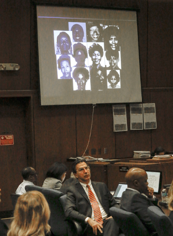 A montage of photos of alleged victims is projected on a screen in the courtroom during the during closing arguments in the serial murder trial of Lonnie Franklin Jr., seated at far left, in Los A ...