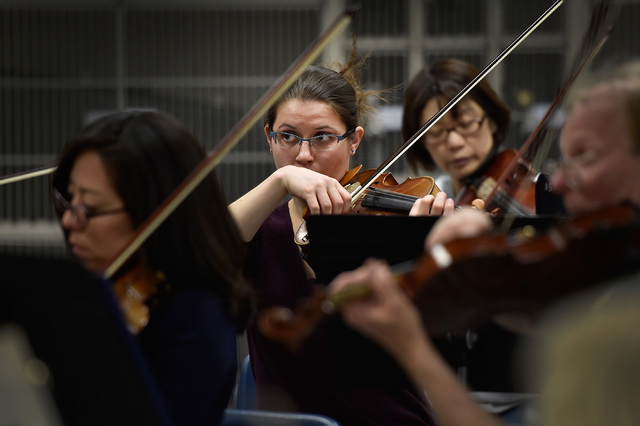 Megan Thompson, center, plays the violin during a Henderson Symphony Orchestra rehearsal at Greenspun Junior High School May 2, 2016. David Becker/View Follow @davidjaybecker on Twitter.