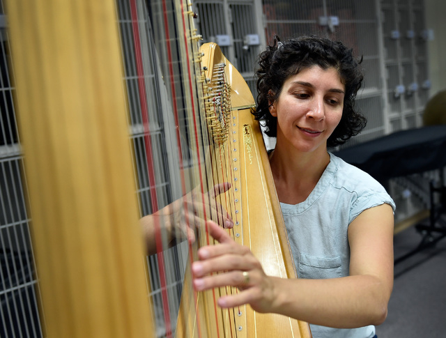 Cathryn Daniels plays her harp during a Henderson Symphony Orchestra rehearsal at Greenspun Junior High School May 2, 2016. David Becker/View