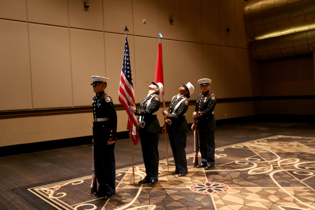 Mark Stratton, left, Kailee Moore, Jackie Williams, and Vincent Laub of the ROTC color guard wait to perform at Touro University Nevada's graduation ceremony at the Rio Hotel and Casino Sunday, Ma ...