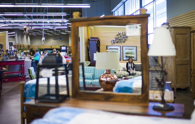 Colleen Aiken, owner of Colleen's Classic Consignment, poses for a photo, reflected in a mirror, in one of her stores at 5120 S. Fort Apache Road in Las Vegas on Friday, May 6, 2016. Chase Stevens ...
