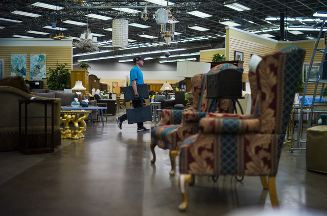 Matt Bernstein helps with rearranging items in Colleen's Classic Consignment at 5120 S. Fort Apache Road in Las Vegas on Friday, May 6, 2016. Chase Stevens/View Follow @csstevensphoto