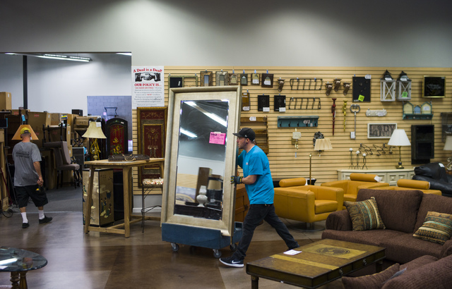 Matt Bernstein moves a mirror in Colleen's Classic Consignment at 5120 S. Fort Apache Road in Las Vegas on Friday, May 6, 2016. Chase Stevens/View Follow @csstevensphoto