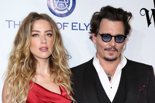 Amber Heard, left, and Johnny Depp arrive at The Art of Elysium's Ninth annual Heaven Gala at 3LABS, in Culver City, Calif., in January 2016. (Rich Fury/Invision/AP)