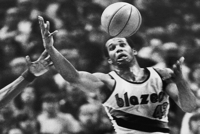 Portland Trail Blazers'  Kermit Washington gains control of a loose ball during an NBA basketball game against the Golden State Warriors in Portland, Ore. Washington. (Jack Smith/AP)