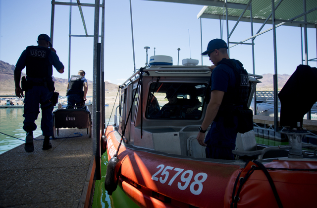 U.S. Coast Guard officers load a boat at the Government Dock at the Las Vegas Boat Harbor on Lake Mead on Friday, May 27, 2016. The coast guard will have a presence at Lake Mead during Labor Day w ...
