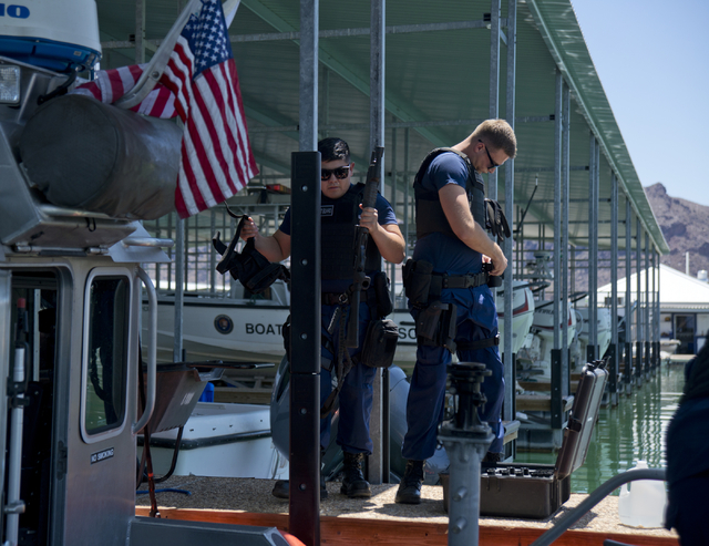 U.S. Coast Guard officers Roman Chapetti, left, and Jacob "Salty Dog" Salts load a boat at the Government Dock at the Las Vegas Boat Harbor on Lake Mead on Friday, May 27, 2016. The coast guard wi ...