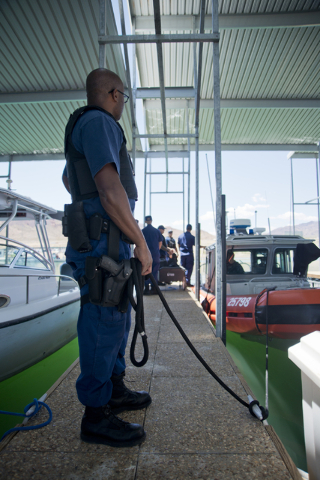 U.S. Coast Guard officer Patrick Dixon prepares to launch a boat at the Government Dock at the Las Vegas Boat Harbor on Lake Mead on Friday, May 27, 2016. The coast guard will have a presence at L ...