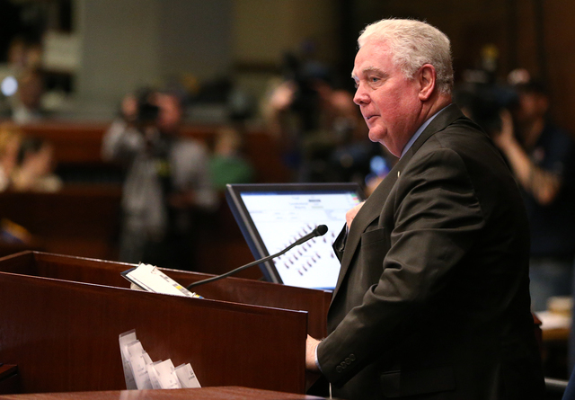Nevada Assembly Speaker John Hambrick, R-Las Vegas, works on the Assembly floor during opening day ceremonies at the Legislative Building in Carson City, Nev., on Monday, Feb. 2, 2015. (Cathleen A ...