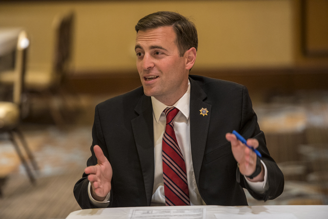 Adam Laxalt, Nevada attorney general, works with military families with legal issues during a military appreciation event at the Texas Station hotel-casino in Las Vegas on Monday, May 23, 2016. Jo ...