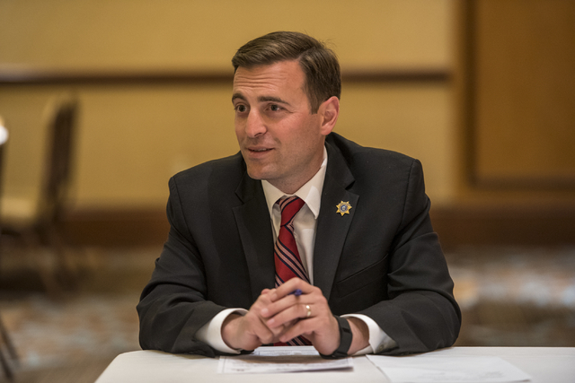 Adam Laxalt, Nevada attorney general, works with military families with legal issues during a military appreciation event at the Texas Station hotel-casino in Las Vegas on Monday, May 23, 2016. (J ...