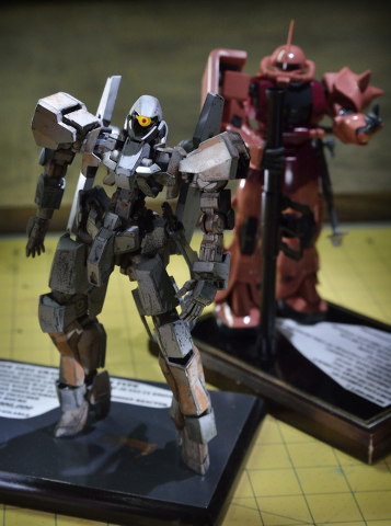 A pair of Gundams based on Japanese anime built by Joe Porche are shown during a meeting of the Las Vegas chapter of the International Plastic Modelers Society at his home in Las Vegas on Wednesda ...