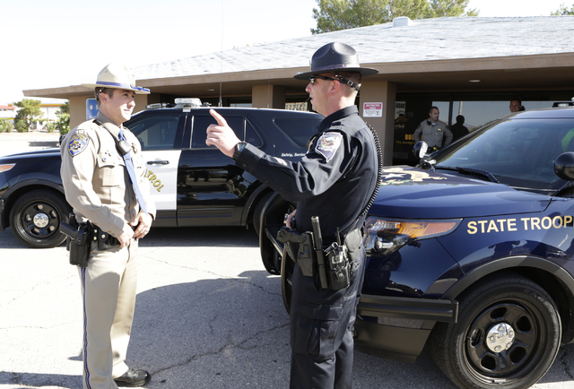 California Highway Patrol trooper Ryan Camara, left, and Nevada Highway Patrol trooper Jason Buratczuk chat outside the NHP substation in Jean on Friday, May 27, 2016. The Nevada Highway Patrol an ...