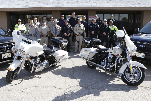 California Highway Patrol troopers, Nevada Highway Patrol troopers, Henderson and Metro Police officers pose for a photo outside the NHP substation in Jean on Friday, May 27, 2016. (Bizuayehu Tesf ...